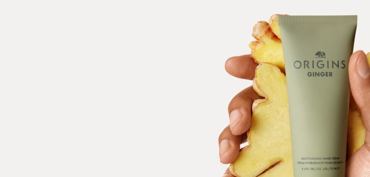 close up of raw ginger of which scent is contained in Origins Ginger body products